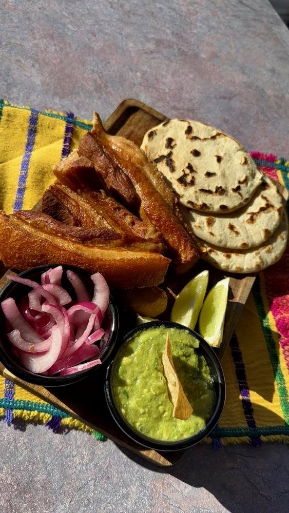Served with tortillas, guacamole and pickled onion.